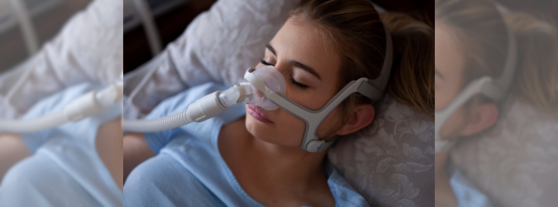 Someone with a sleep apnea device